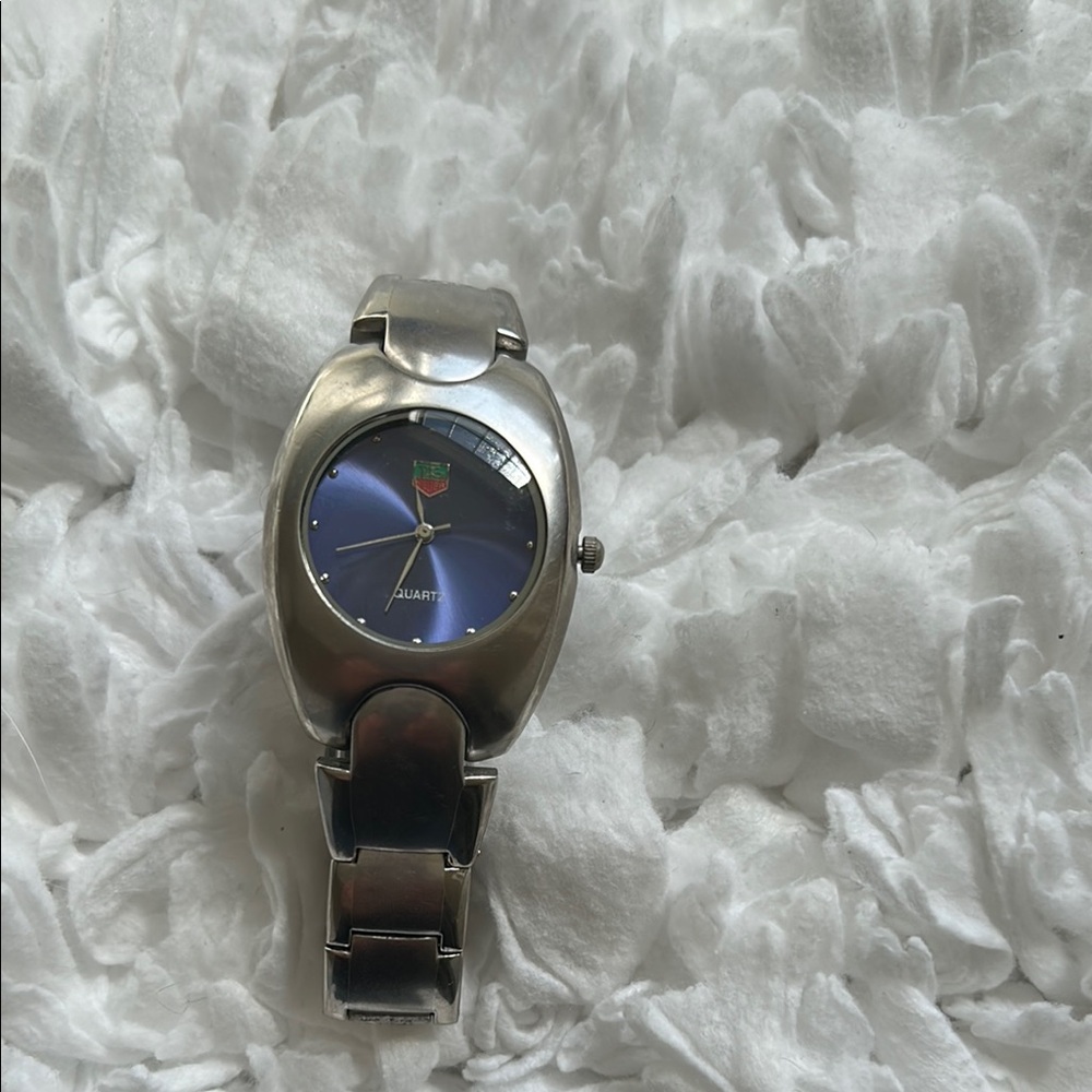 Silver and Blue face tag watch in great condition. Just needs a battery.